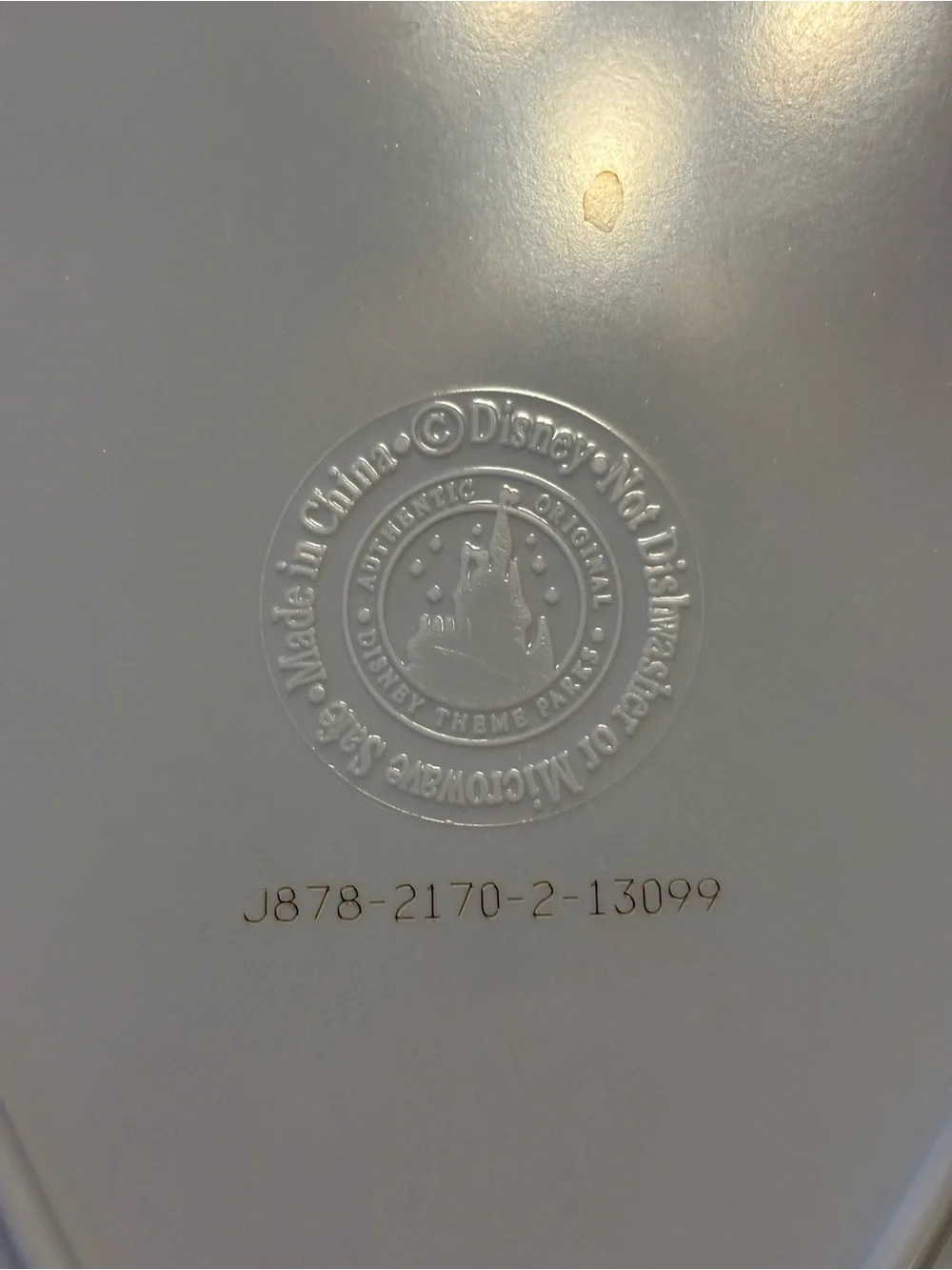 Disney White Embossed Seal Panel with Gold Stamp